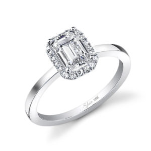 Simple halo style diamond engagement ring with an emerald cut center stone
