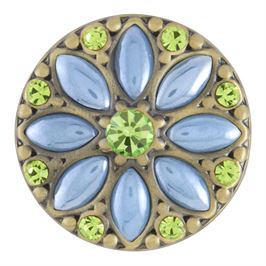 This snap from Ginger Snaps© features light blue marquise and peridot colored round gems over a brass background