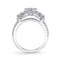 Side profile of a white gold three stone, halo engagement ring from the Sylvie Collection with half-moon shaped diamonds