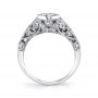 Side profile of a vintage style white gold diamond engagement ring from the Sylvie Collection