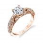 A rose gold diamond engagement ring from the Sylvie Collection featuring diamond accented swirling shapes and a large center diamond with prongs that cross over each other