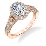A rose gold diamond engagement ring from the Sylvie Collection featuring an oval shaped diamond in the center of a halo mounting with milgrain accents and an art deco style