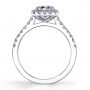 Side profile of a white gold diamond engagement ring from the Sylvie Collection features a round diamond in the center with a cushion shaped halo around it