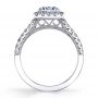 Side profile of a white gold diamond engagement ring from the Sylvie Collection featuring a prominent round diamond in the middle of a cushion shaped halo
