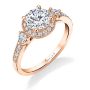 A rose gold three stone diamond engagement ring with a halo around the center diamond from the Sylvie Collection