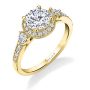 A yellow gold three stone diamond engagement ring with a halo around the center diamond from the Sylvie Collection