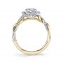 Side profile of a two-tone white and yellow gold diamond engagement ring from the Sylvie Collection featuring a twisting diamond shank and halo