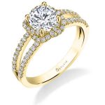 A yellow gold diamond engagement ring from the Sylvie Collection featuring a twisting halo type design with a split shank