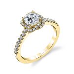A yellow gold diamond engagement ring from the Sylvie Collection featuring a braided halo around the center stone