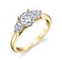 A yellow gold diamond engagement ring from the Sylvie Collection featuring a large round diamond with a slightly smaller round diamond on either side