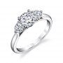 A white gold diamond engagement ring from the Sylvie Collection featuring a large round diamond with a slightly smaller round diamond on either side