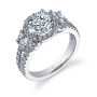 A white gold three stone, halo engagement ring from the Sylvie Collection with half-moon shaped diamonds