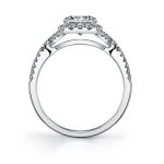 Side profile of a white gold diamond engagement ring from the Sylvie Collection highlighted by a twisting diamond shank and a cushion shaped halo around a round diamond