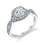 A white gold diamond engagement ring from the Sylvie Collection highlighted by a twisting diamond shank and a cushion shaped halo around a round diamond