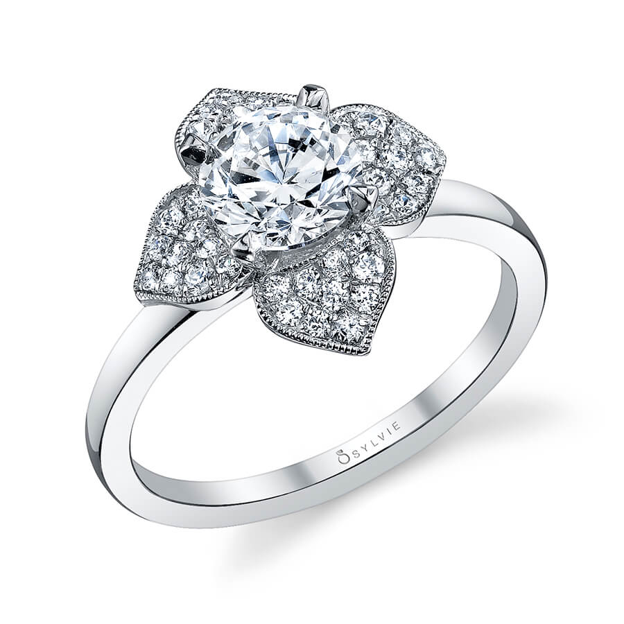 A white gold diamond engagement ring from the Sylvie Collection featuring four diamond studded petals