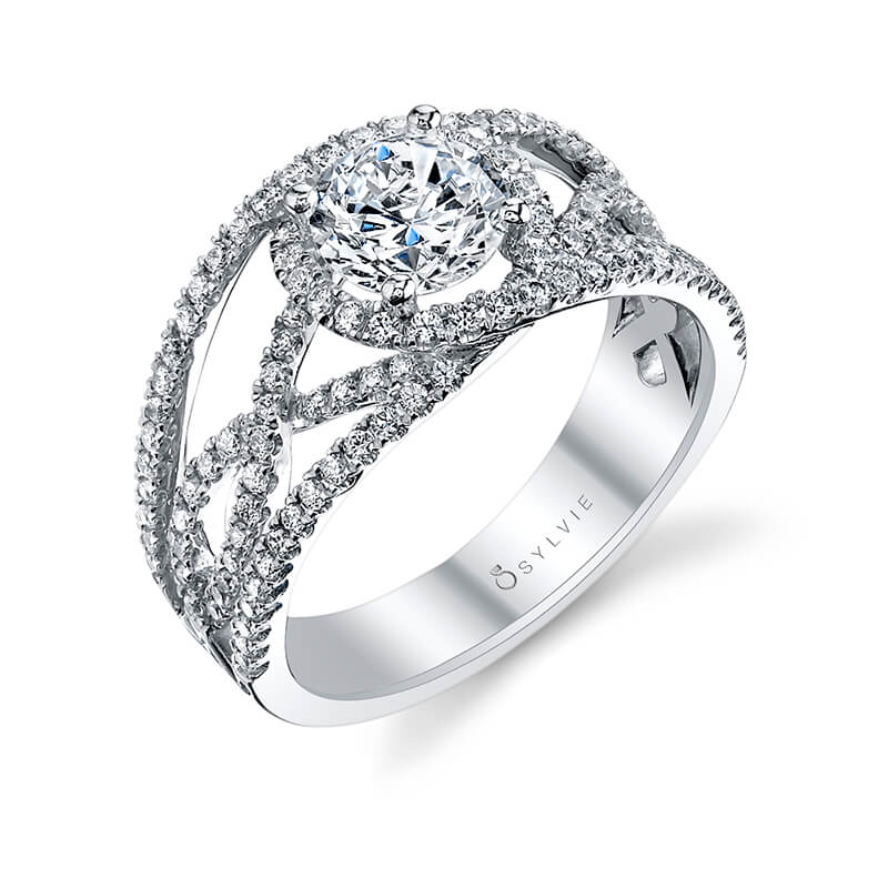 A white gold diamond engagement ring from the Sylvie Collection featuring a prominent round diamond and an open weaving diamond pattern