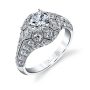 A diamond engagement ring from the Sylvie collection in white gold with geometric patterns surrounding a large center diamond