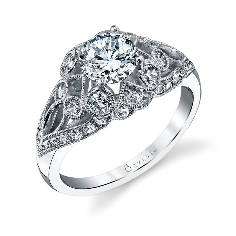 A white gold diamonds engagement ring from the Sylvie Collection featuring diamonds among the sweeping designs