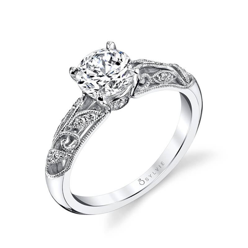 A white gold diamond engagement ring from the Sylvie Collection featuring floral motifs with diamond accents