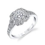 A white gold diamond engagement ring featuring a floral halo design