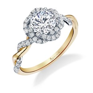 A two-tone white and yellow gold diamond engagement ring from the Sylvie Collection featuring a twisting diamond shank and halo