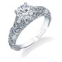 A white gold vintage style engagement ring from the Sylvie Collection featuring a large center stone accented by diamond beset swirling patterns