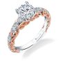 Prominent rose gold swirls adorn the side of a white gold diamond studded white gold two-tone engagement ring from the Sylvie Colection