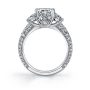Side profile of a white gold three-stone diamond engagement ring with peek-a-boo diamonds from the Sylvie Collection