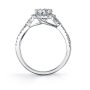 Side profile of a white gold diamond engagement ring from the Sylvie Collection featuring an oval shaped diamond in the middle with an corresponding halo and a twisting diamond shank