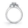Side profile of a white gold diamond engagement ring from the Sylvie Collection featuring a diamond halo around three prominent diamonds