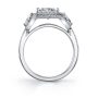 Side profile of a white gold diamond engagement ring featuring a large princess cut diamond with a halo and two accompanying triangle cut diamonds from the Sylvie Collection