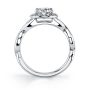 Side view of a white gold diamond engagement ring from the Sylvie Collection featuring a plain twisting shank and a round diamond inside of a halo mounting