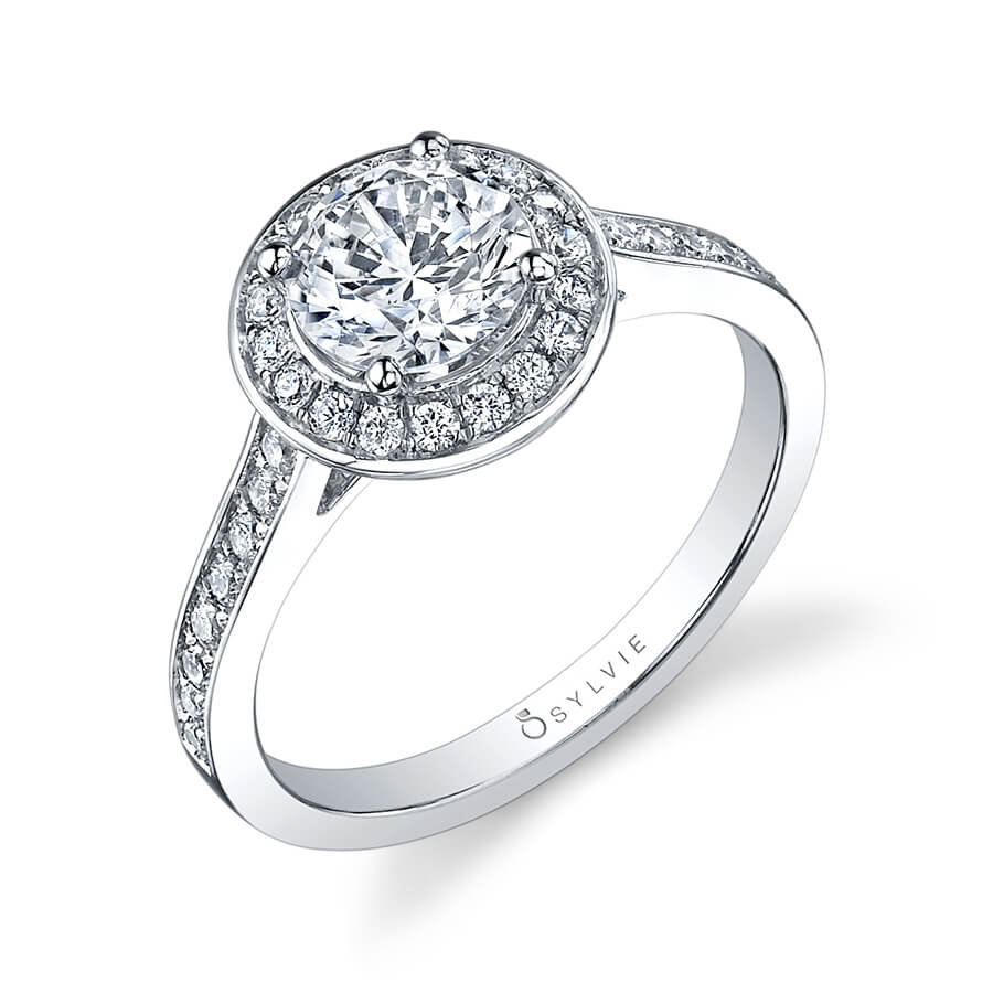 A white gold diamond engagement ring from the Sylvie Collection featuring a round diamond encircled by a halo setting