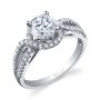A white gold diamond engagement ring from the Sylvie Collection featuring a round center diamond and a twisting shank with diamonds