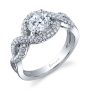 A white gold diamond engagement ring from the Sylvie Collection featuring swirling diamond shank and a round diamond