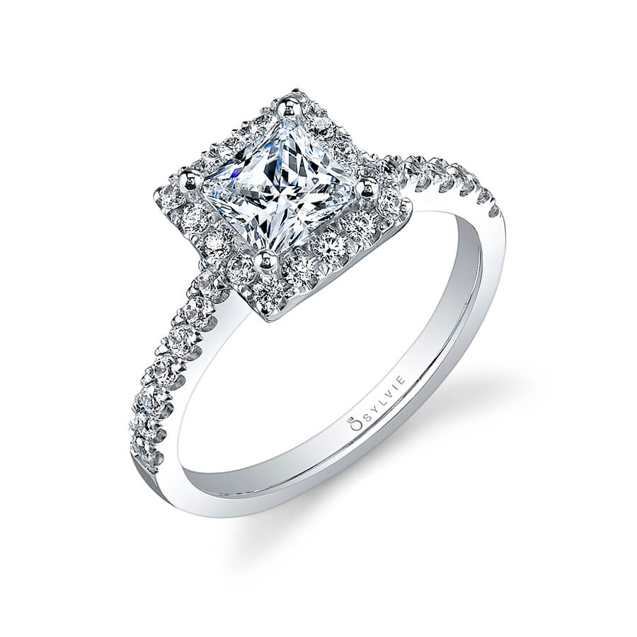 A white gold diamond engagement ring from the Sylvie Collection featuring a princess cut diamond in a square halo mounting