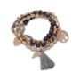 champagne and gold tone set of four stretch bracelets with tassels and charms